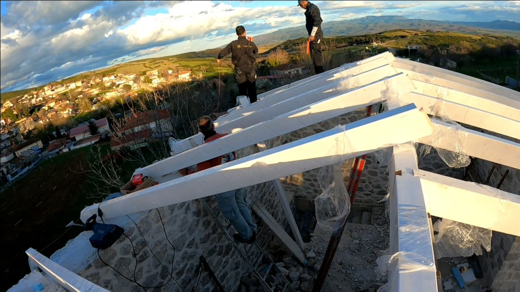 Roof Energy crew on the timber skeleton at Petroto Domokou