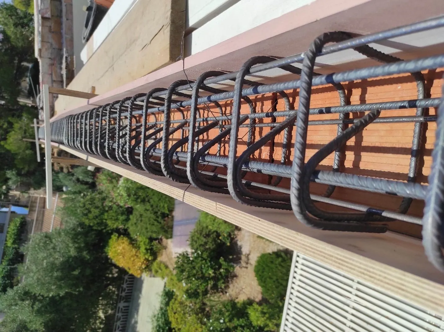 The reinforced perimeter ring beam taking shape, steel rebar reinforced at the corners.