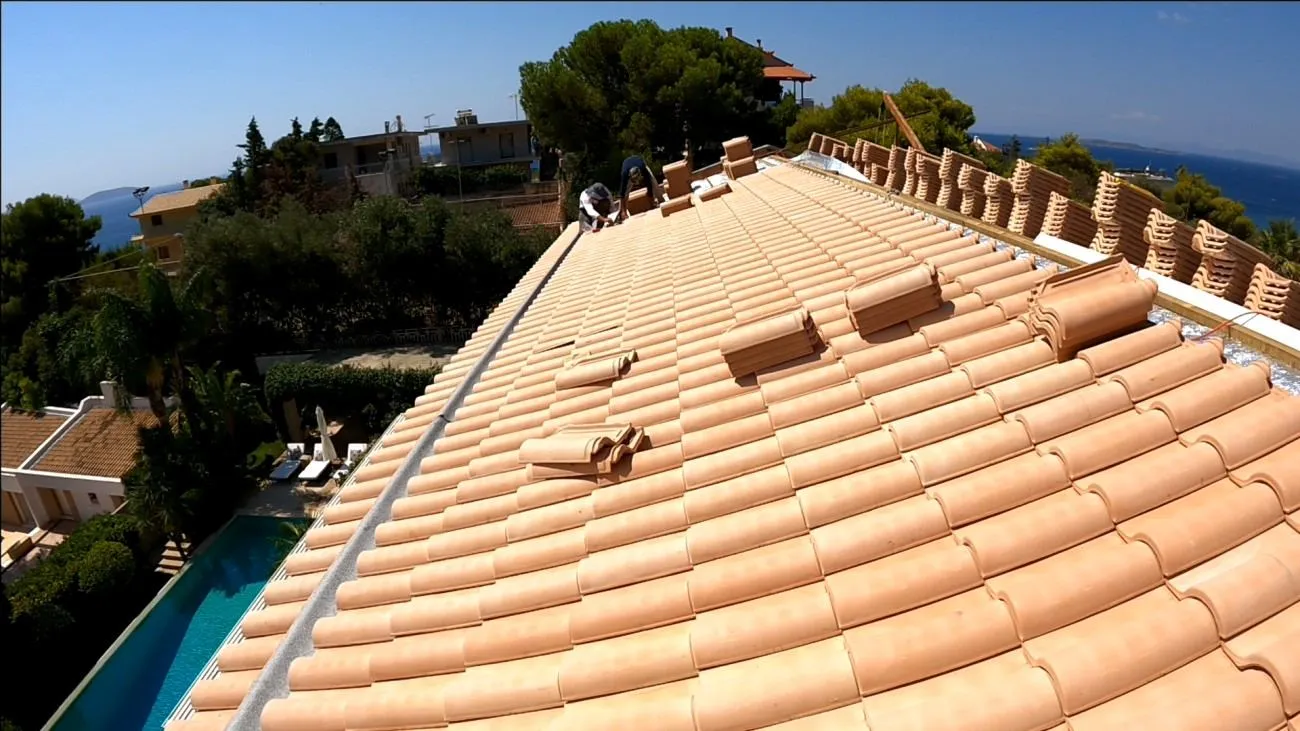 The finished roof in natural Panagiotopoulos clay tile on the Athenian Riviera
