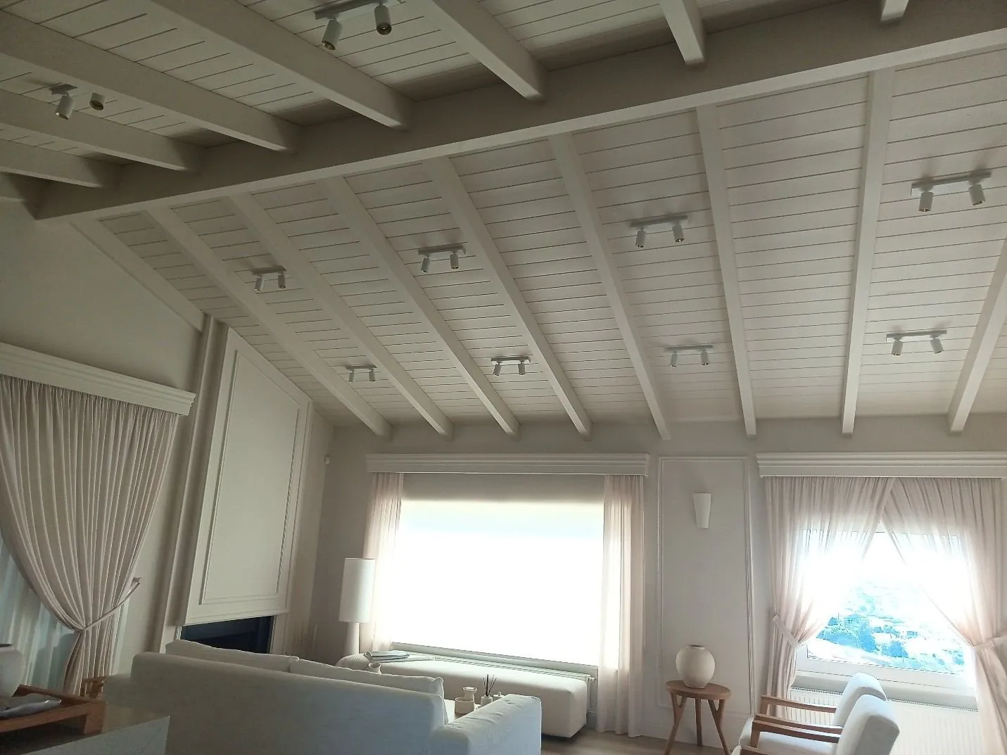 Inside, after. The new timber ceiling above the family living room. Furniture-grade finish.